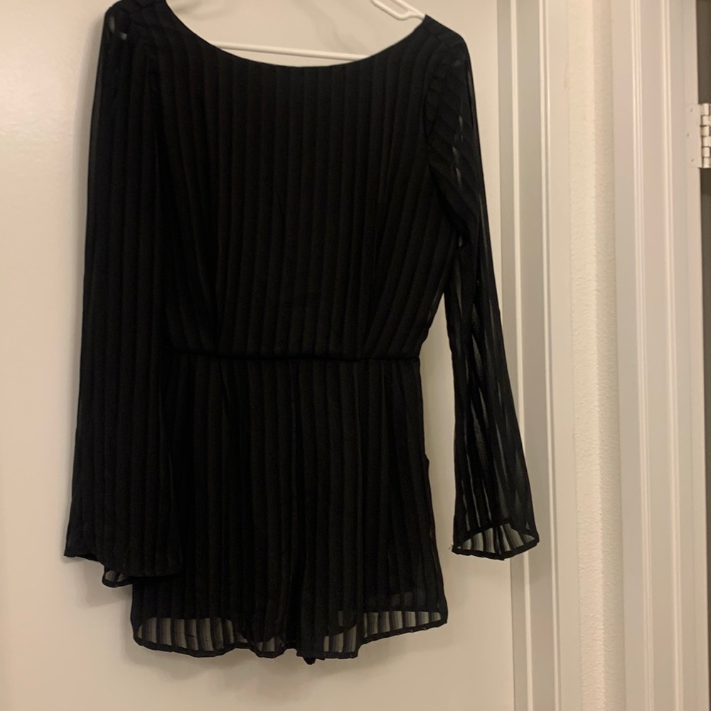 Black Long-Sleeve Romper with shear black stripes.